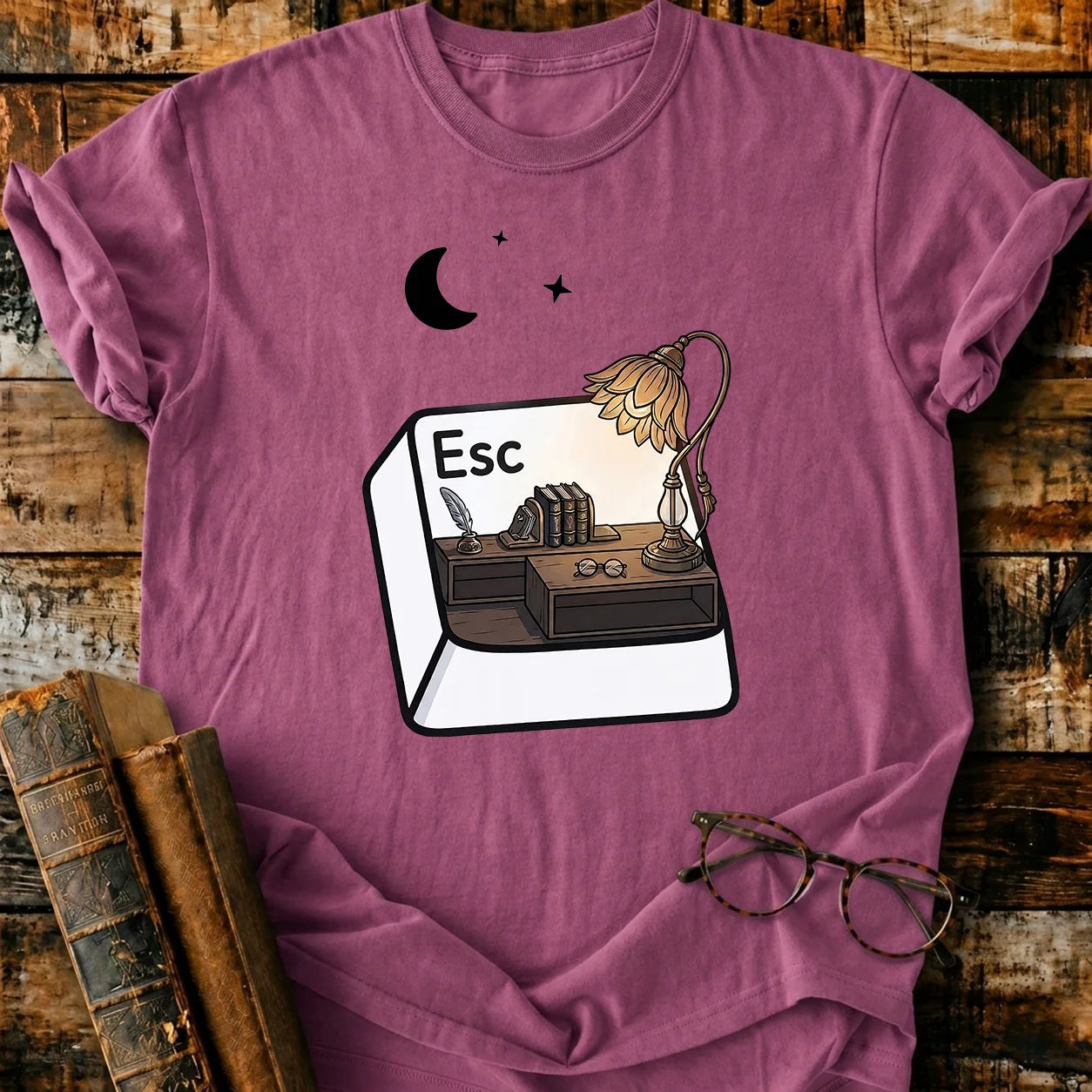 Plum Comfort Colors Escape T-shirt with a desk, books, lamp, and moon design.